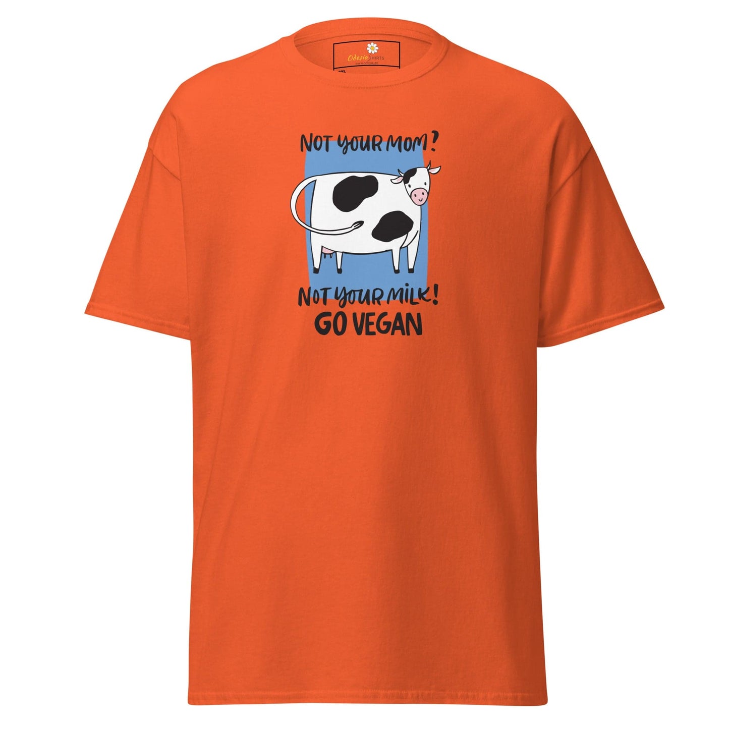 Orange t-shirt with cow graphic.